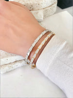 Serpentine Splendor: Mother of Pearl and Crystal Snake Bone Bracelet